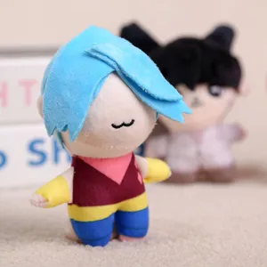 Close-up detail of a cute cartoon anime plush doll pendant featuring blue hair and colorful outfit.