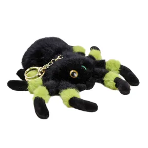 Fluffy black and green spider plush keychain, cute stuffed animal pendant backpack charm.