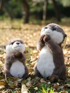 Cute otter plush toy simulation stuffed animal doll with praying pose for kids birthday gift.