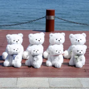 Simpatico orsetto di peluche bianco con sciarpa lavorata a maglia morbido regalo compleanno