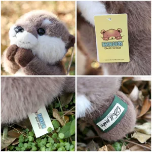 Cute otter plush toy detail shot, showing soft fur texture, brand hang tag and woven label.