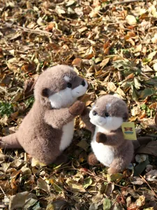 Detailed view of cute simulated otter plush toys, soft and cuddly animal doll for kids gift.