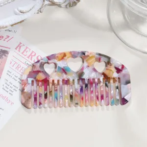 Acetate hair comb with heart cutout, vintage tortoiseshell multicolored bangs hair styling tool.