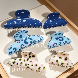 Close-up of assorted patterned hair claws, cute and stylish hair accessories for daily wear.