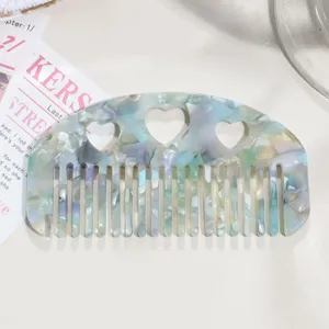 Acetate hair comb with cute heart cutouts and colorful marbled tortoiseshell design for women