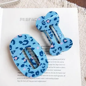 Blue leopard print acrylic hair claw clips set, cute hollow bone and oval designs for daily wear.