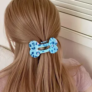 Blue bone hair claw clip detail, cute leopard print hair accessory for daily styling.