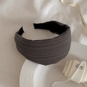 Dark grey striped wide headband, fabric hair hoop detail showing soft texture and elegant design.