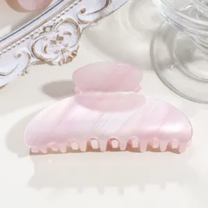 Pink acetate crescent hair claw clip, stylish medium shark clip for elegant daily hairstyles.