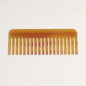 Tortoiseshell acetate wide tooth comb detail shot, anti static hair styling comb for women.