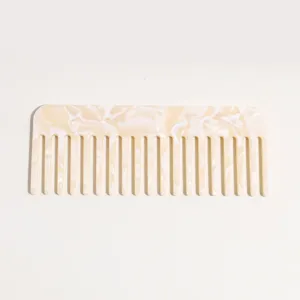 Cellulose acetate wide tooth comb detail view, anti-static hair detangling tool for long hair.