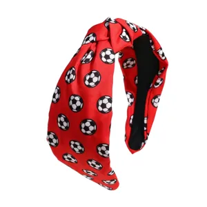Red soccer ball pattern knotted fabric headband for women, stylish sports hair accessory.