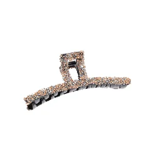 Large rhinestone hair claw clip for women, sparkling crystal shark clip for thick hair styling.