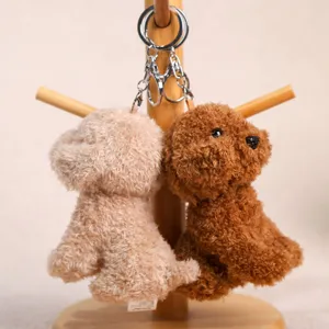 Cute poodle puppy plush keychain couple bag pendant soft toy detail view showing fluffy texture.