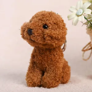 Cute brown poodle plush toy keychain detail, soft fluffy stuffed animal plush pendant.