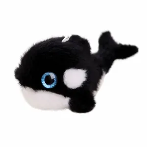 Cute killer whale plush toy pendant, soft fluffy orca stuffed doll with blue glitter eyes.