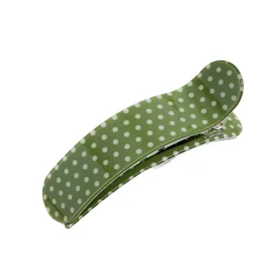 Green polka dot curved acetate hair clip for women, elegant duckbill clip for half updo styling.