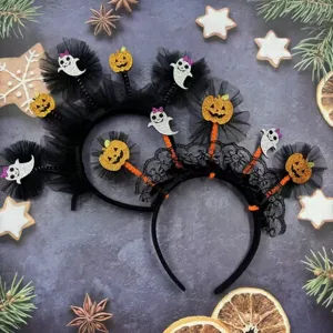 Halloween headband detail view featuring black mesh, glitter pumpkins and ghosts for party.