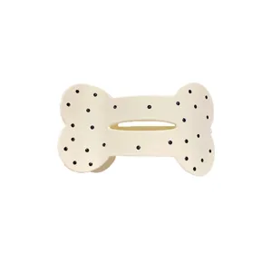 Lindo pasador de pelo en forma de hueso con puntos negros accesorio dulce para niñas.