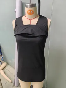 Detail shot of the black multifunctional sleeveless V-neck top showing the neckline design.