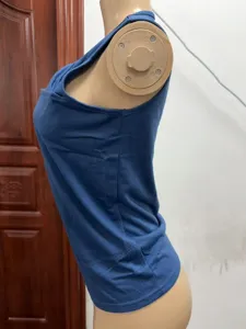 Detailed side view of a solid blue sleeveless top on a mannequin, showcasing slim fit.