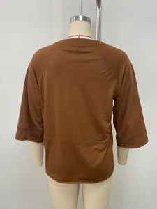 Women solid color crew neck three quarter sleeve loose t-shirt back view casual wear