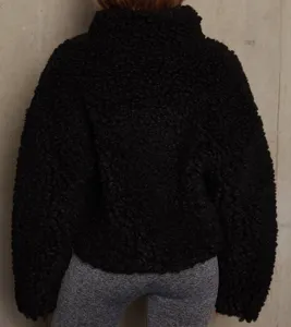 Stylish black fuzzy fleece jacket for women, cozy short winter coat with warm stand collar.