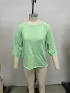 Mint green casual crewneck 3/4 sleeve t-shirt detail showing raglan sleeves and stitching.