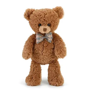 Adorable peluche d'ours en peluche marron moelleux avec nœud papillon à carreaux cadeau.