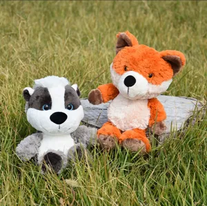 Cute forest animal fox and badger plush toys detail view showing soft fluffy toy material.