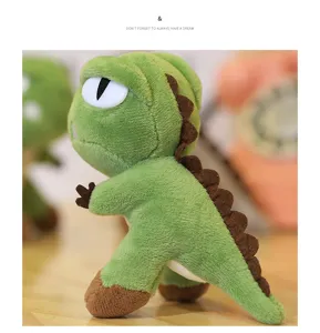Detailed shot of cute green dinosaur plush toy standing on wooden desk with soft background.