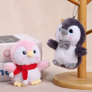 Cute plush penguin keychain set, soft stuffed doll pendant with scarf for backpack decor.