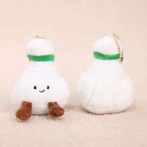 Simpatico ciondolo in peluche da badminton con viso sorridente e catena dorata.