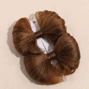 Vue détaillée de la pince à cheveux nœud marron synthétique pour femme et fille style.