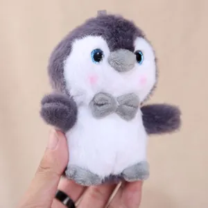 Cute penguin plush pendant toy, soft stuffed animal keychain for school bag and backpack accessory.