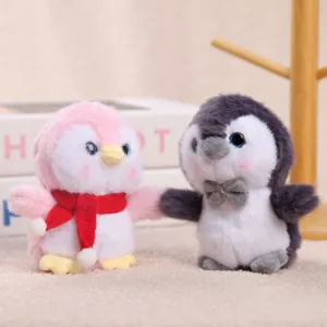Cute plush penguin toy couple with scarf and bow, soft stuffed animal doll pendant gift.