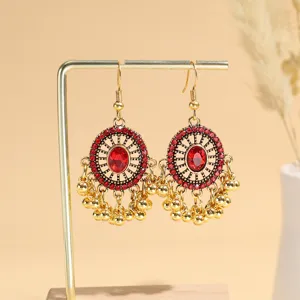 Vintage gold-plated red crystal drop earrings for women, ethnic tassel dangle jewelry.
