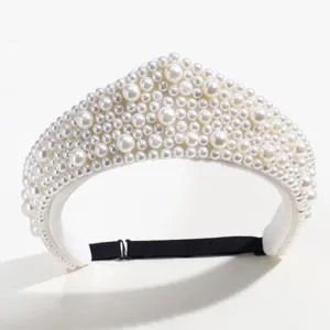 Detailed view of a retro pearl crown headband, elegant court style hair accessory with pearls.