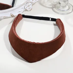 Retro brown velvet headband detail close-up showing fine fabric texture and elastic strap.