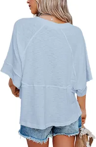 Back detail of casual light blue loose t-shirt with raglan sleeves and seam accent.