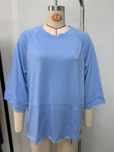 Detailed view of a light blue casual crew neck raglan sleeve women t-shirt on mannequin.
