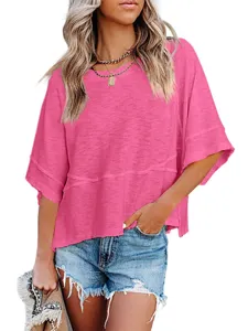 Detail shot of casual loose three-quarter sleeve patch t-shirt for women in hot pink.