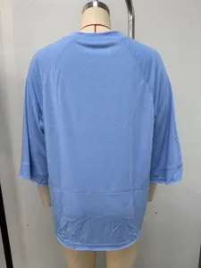 Back view detail of casual light blue solid color o-neck raglan sleeve women t-shirt