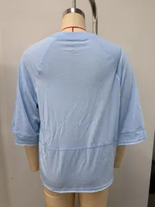 Back view of a casual light blue crew neck mid-sleeve raglan t-shirt for women, comfortable fit.