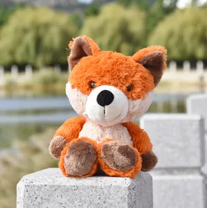 Cute orange plush fox toy outdoor detail shot, very soft material, wonderful gift.