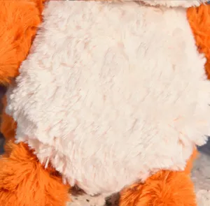 Plush toy detail close-up view showing soft orange and cream fluffy faux fur texture.
