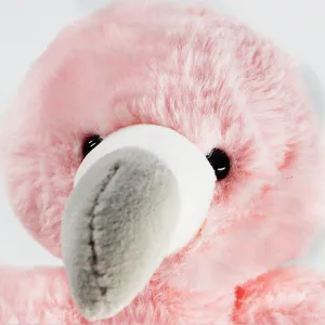 Close-up detail of fluffy pink flamingo plush toy head showing soft fabric and stitched beak.
