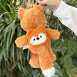 Cute orange fox plush toy with mini backpack detail, soft stuffed animal doll for kids and gifts.