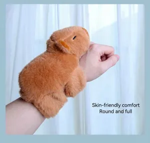 Detailed view of the cute capybara plush slap bracelet, soft texture worn on wrist display.