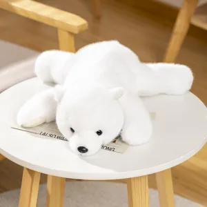 Detail view of a cute white polar bear plush toy, soft sleeping pillow and adorable animal decor.